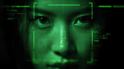 Facial recognition technology interface with green scanning frames on human face creating futuristic biometric concept