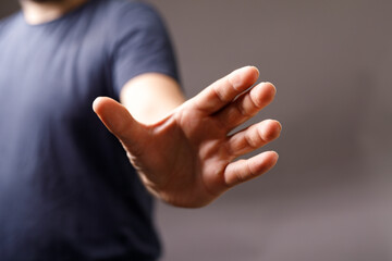 Close-up of a man's hand outstretched, palm open.  Perfect for concepts of help, hope,  reach, and...