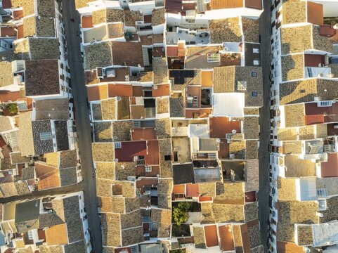 Streets and rooftops in the White Town of Olvera. Aerial view. Drone shot. C&aacute;diz province, Andalusia, Spain