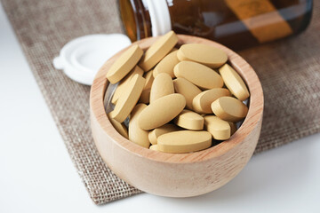 close up of Vitamin C pill. Nutritional supplement, healthy lifestyle background.