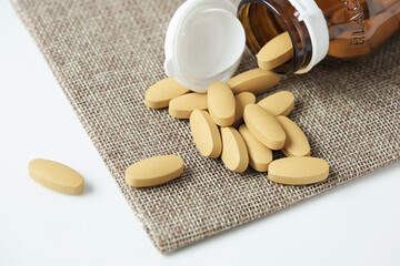 close up of Vitamin C pill. Nutritional supplement, healthy lifestyle background.