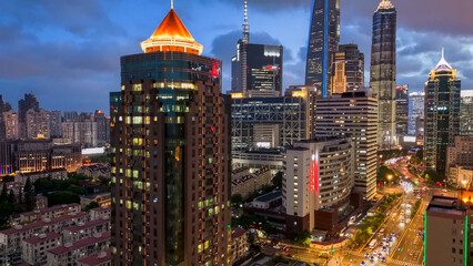 Vibrant Metropolitan Skyline at Dusk with Illuminated Modern Skyscrapers and Busy Urban Streets