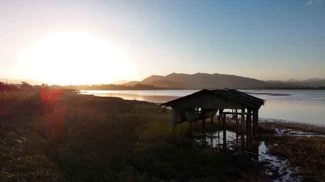 Serene Brazilian Sunset: Golden Hour Drone Shot Over a Coastal Lagoon