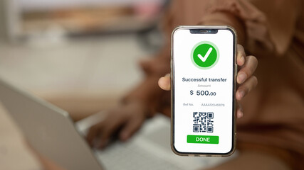 Mobile Banking Successful Transfer with QR Receipt and Laptop