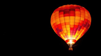 Obraz premium Illuminated Hot Air Balloon Against Black Background
