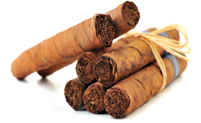 Hand rolled cigars with tobacco leaves and string on black background