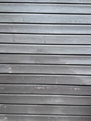 Obraz premium Wooden Panel Wall with Horizontal Boards in Rustic Outdoor Setting 