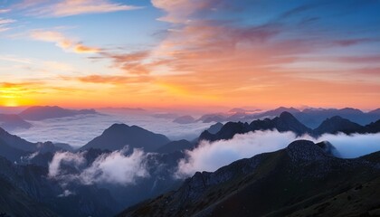 Obraz premium Colorful Sunrise Over Mountains With White Smoke And Cloud Formations In The Background