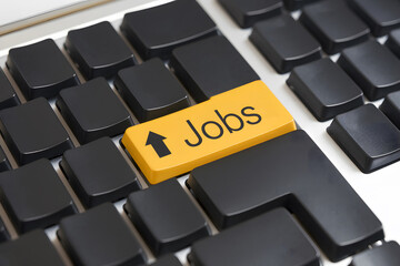 Job Opportunities Highlighted on a Computer Keyboard. AI Generated