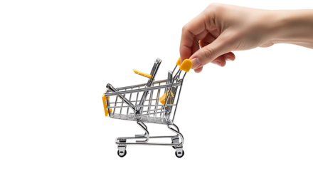 A miniature shopping cart with bright yellow handles is presented against a black backdrop, featuring a hand reaching out to grasp the handles.
