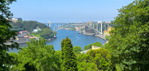 Panoramic view of Arrabida bridge and Douro river in Porto, Portugal. Scenic summer landscape with