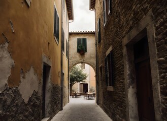Obraz premium Quaint European Alley with Archway and Courtyard