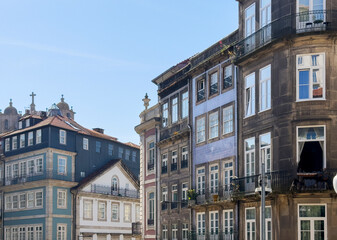 Fototapeta premium Traditional tiled facades and historic buildings in Porto, Portugal. Colorful architecture with