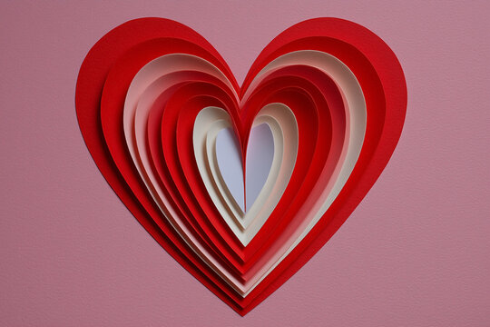 Nested paper hearts in gradient shades of red and white on a pink background. Expressing love, affection, and heartfelt sentiments.