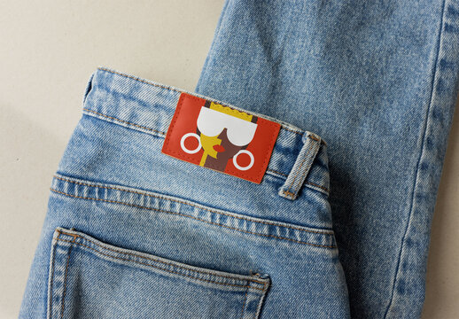 leather jacron denim label attached to a pair of jeans. PSD template mockup