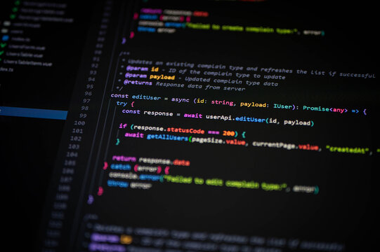 Close-up of TypeScript code editing user data with async functions on a dark IDE. Suitable for modern web development, software engineering, and coding-related projects.