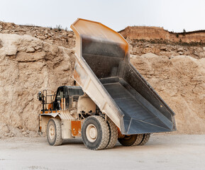 Large dumper truck unloading minerals in a quarry © Maria Vitkovska