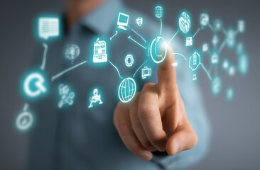 Finger activating digital icons; light emanates from the focal point. The soft background is neutral, and the subject is an arm extending toward the viewer