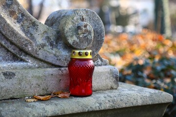 Candle at Rakowicki Cemetery in Krakow. The historic Rakowice necropolis is a cultural heritage...