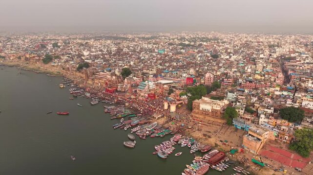 Varanasi, India: Aerial view of famous Dashashwamedh Ghat in ancient holy city on Ganges river - landscape panorama of Southeast Asia from above
