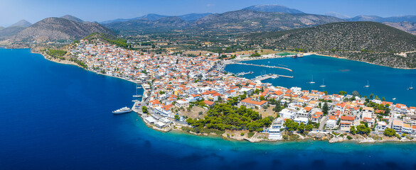 Panoramic aerial view of the town of Ermioni, situated on a peninsula with pine tree forest, Peloponese, Greece