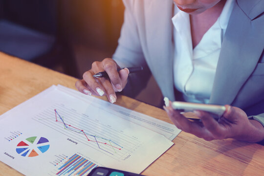 Business Woman Analyzing Report. Financial Data Analysis.