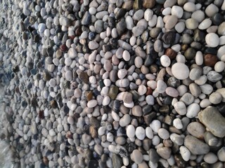 Pile of rocks with some of them being black