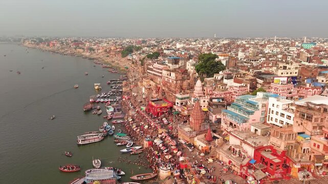 Varanasi, India: Aerial view of famous Dashashwamedh Ghat in ancient holy city on Ganges river - landscape panorama of Southeast Asia from above
