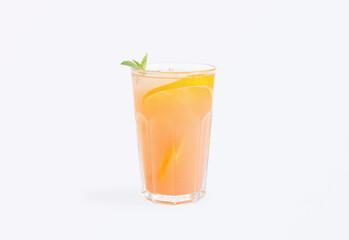 Cool orange lemonade served in a tall glass with fresh orange slices and mint leaves, refreshing summer drink perfect for cafes, restaurants or home, isolated on white background