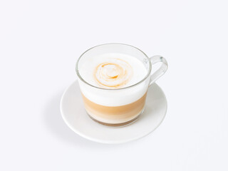 Freshly made cappuccino coffee with creamy milk foam and subtle latte art in clear glass cup on white saucer, isolated on light background, perfect for menu and advertising