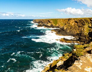 Coastal cliffs meet the ocean waves under a vibrant blue sky