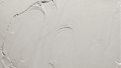 Smooth plaster wall texture with subtle curved trowel marks and soft neutral tone conveying calm minimalism and tactile detail