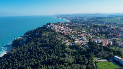 Obraz premium Expansive Aerial Drone View of Numana A Picturesque Coastal Town in Le Marche Italy Overlooking the Adriatic Sea With Lush Greenery and Historic Buildings