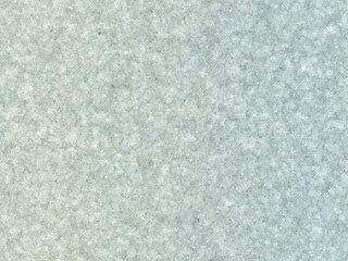 Subtle speckled texture in light gray and blue tones.