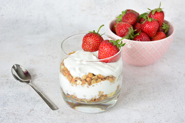 layered Strawberry Yogurt Parfait with Granola and Fresh Strawberries