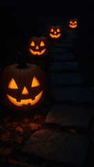 [glowing jack-o’-lanterns along stone path mobile wallpaper]