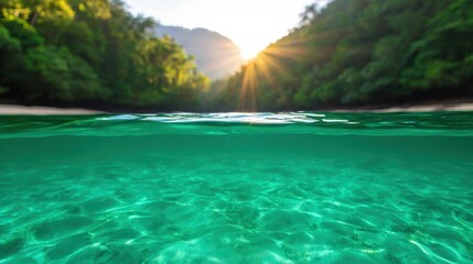 Fototapeta premium A serene view of crystal-clear water reflecting sunlight, surrounded by lush greenery and mountains in the background, creating a tranquil atmosphere.