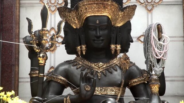 Trimurati statue, Hindu god statue in temple.	