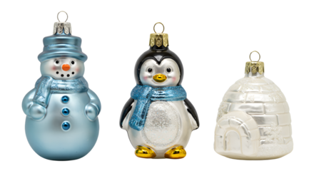 Blue snowman, penguin with scarf, and white igloo Christmas ornaments set on white background perfect for holiday decoration
