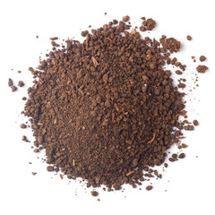 pile of dark brown compost soil with granular texture, loose pieces scattered around edges, isolated white background, taken from above