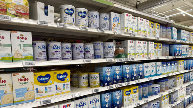 Warsaw, Poland - June 28, 2025: Baby formula products displayed on supermarket shelves with various brands