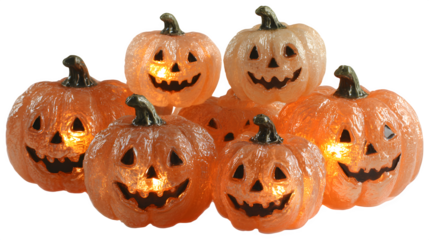 Group of glowing Halloween pumpkins cut-out for festive decor, isolated on white background