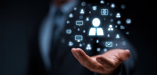 Businessman holding a holographic display of interconnected digital people and communication icons
