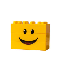 Fototapeta premium Playful yellow building block smiley face