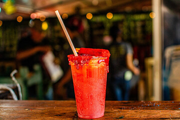 Refreshing mexican drink with chili powder and tamarind candy celebrating independence day in september