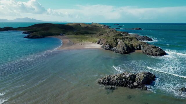 Drone flight over Llanddwyn Island at Newborough Warren on the Isle of Anglesey in Gwynedd off the north Wales coast.