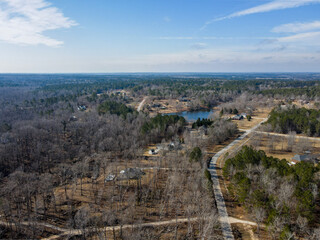 Aerial landscape rural neighborhood winter after Hurricane Helene in Appling Augusta Georgia