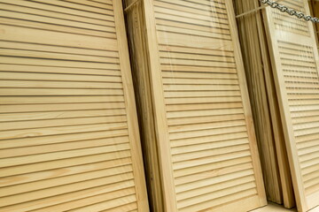 Wooden slats arranged neatly at a construction site, showcasing craftsmanship and preparation for home renovation projects