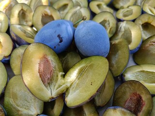 ripe large plum in section close-up