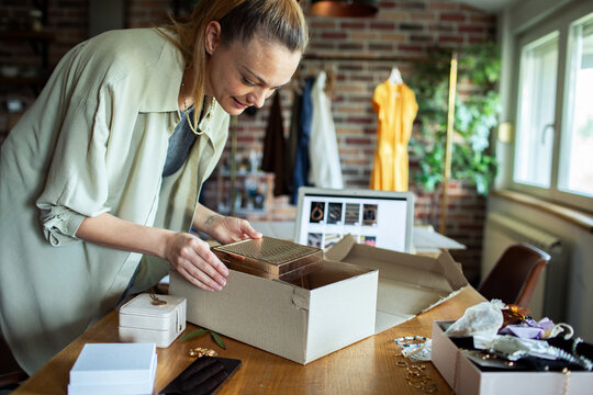 Woman Unpacking Jewelry Box